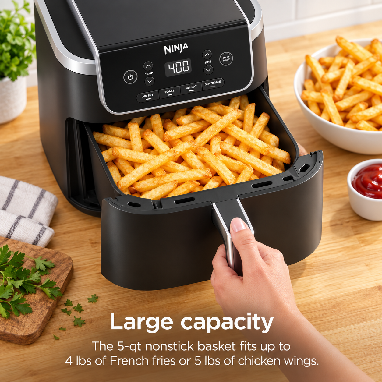 Large air fryer basket filled with crispy fries